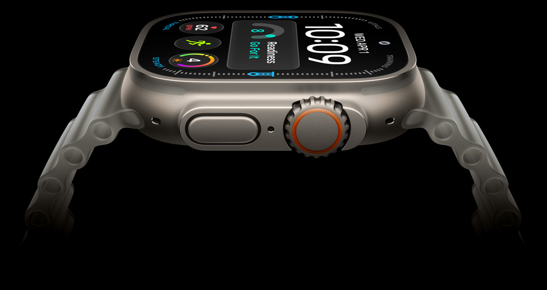 Apple Watch Ultra 4, titanium case, natural color, digital clock face, complications: readiness, heart rate, Workouts, UV, right side exterior, Digital Crown, raised side button, Ocean Band, translucent gray color